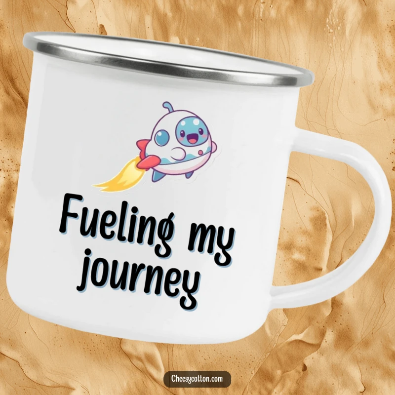 Funny enamel camping mug with a tiny, excited spaceship character leaving a shimmering trail, perfect for outdoor adventures and humor.