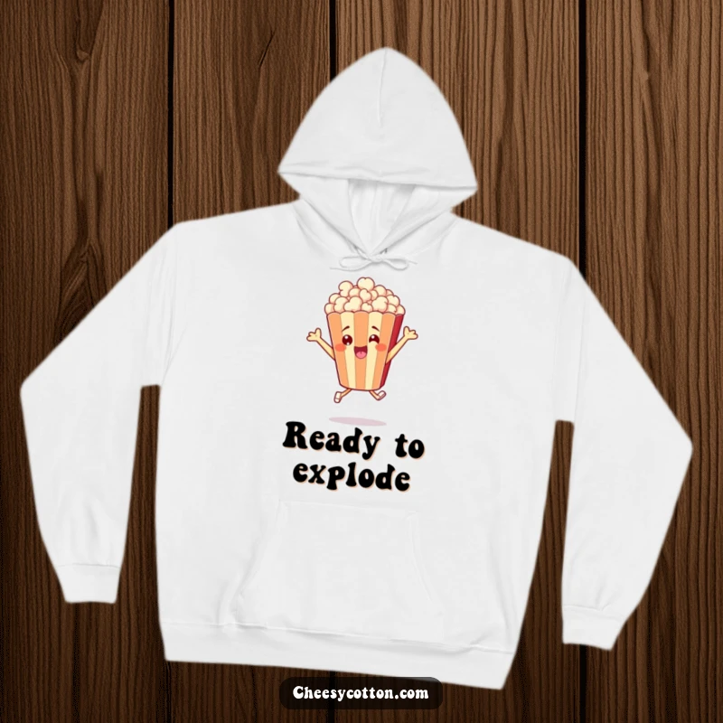 Funny hoodie displaying a cheerful popcorn bag character mid-leap, radiating happiness and cozy vibes.