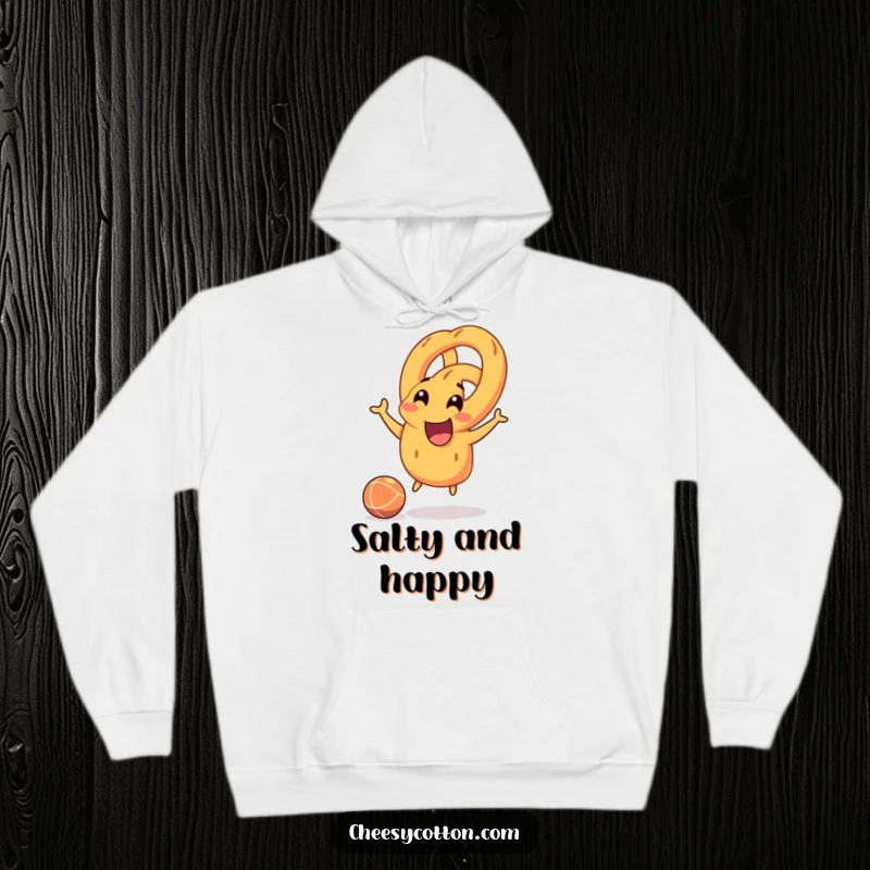 Funny pretzel character joyfully bouncing a rubber ball, soft and comfortable hoodie for playful relaxation.