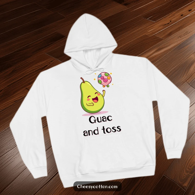 Funny hoodie design of a happy avocado tossing a colorful bean bag, perfect for cozy and cheerful wear.