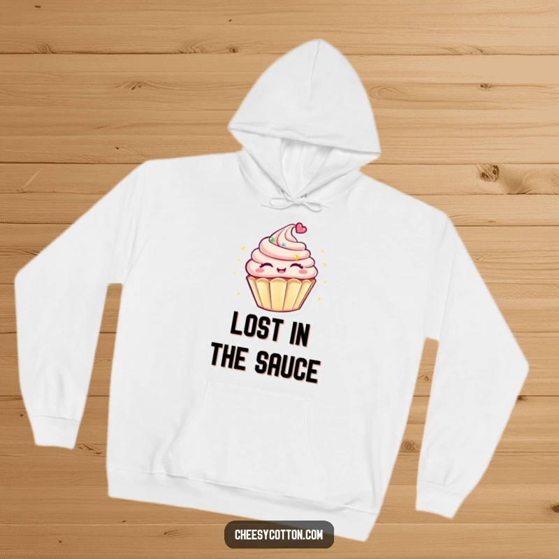 Funny Kawaii Cupcake Hoodie: A cute, round cupcake character spinning with eyes closed, offering cozy comfort and a humorous touch.
