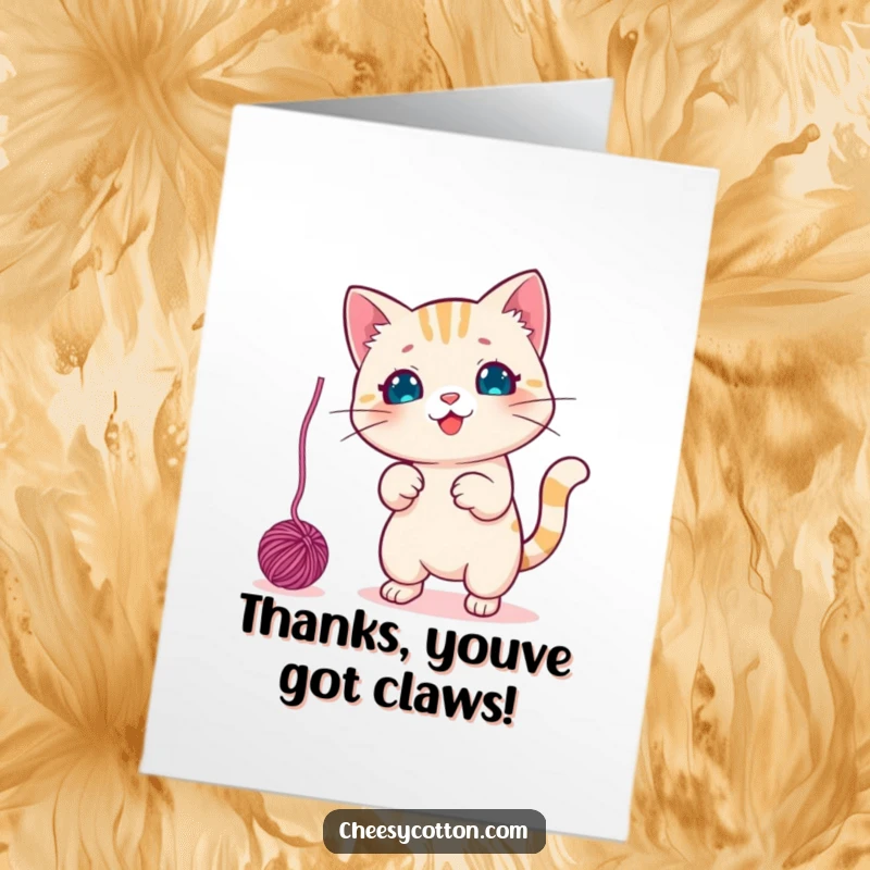 Funny free printable thank you card featuring a cute kawaii cat character engaged in playful swatting of a dangling yarn ball.