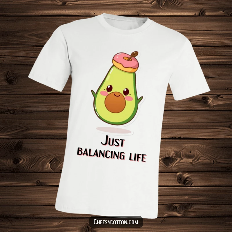 Funny Avocado Donut T-Shirt: A cheerful avocado character performing a balancing act with a donut on its head.