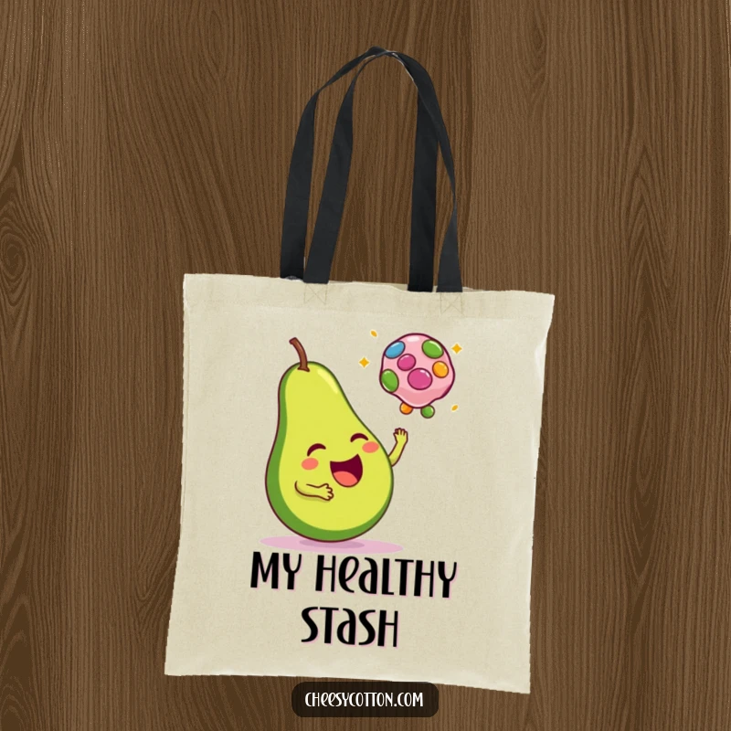 Funny tote bag featuring a happy avocado tossing a colorful bean bag, great for shopping and everyday use.