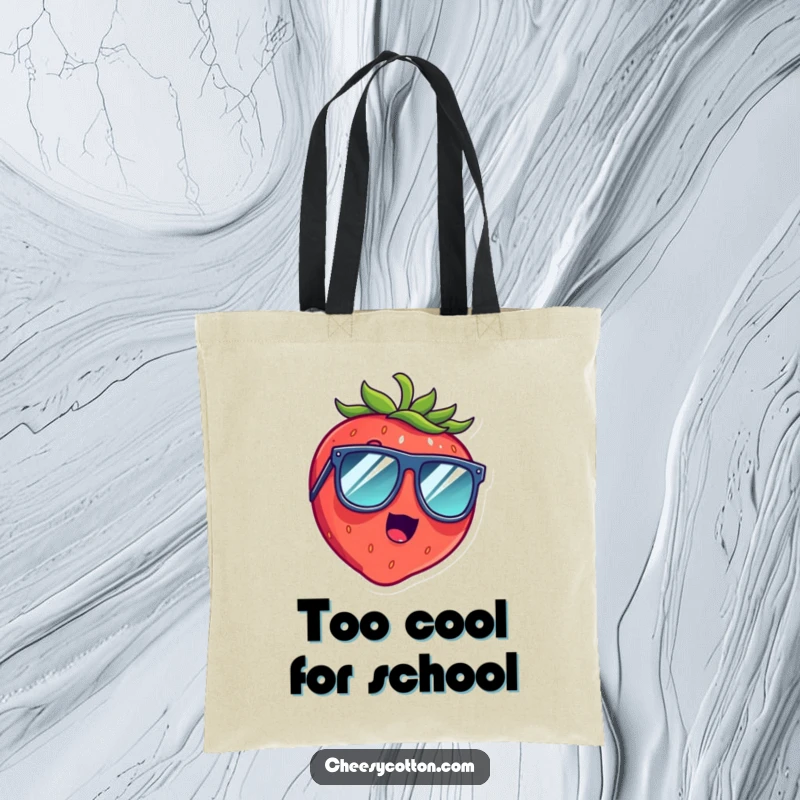 Funny tote bag displaying a shocked strawberry giggling hysterically behind oversized sunglasses, ready for shopping.